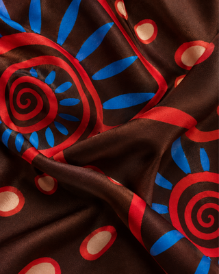 HELIX Nautilus print draped in silky fabric, close-up detail