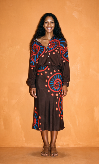 LIANDRA Bias Midi Skirt in Nautilus brown, bias cut satin crepe skimming through the hip